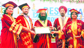 Desh Bhagat University Chancellor Zora Singh (second from left), and other officials of the university confer the degree of DLitt on Sri Sri Ravi Shankar during the annual convocation of the university at Mandi Gobindgarh.