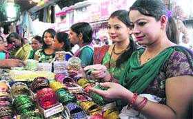Women buy bangles for Karwa-Chauth festival at Paltan Bazaar in Dehradun on Monday