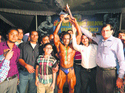 Pankaj Kumar with the Mr Himachal-2013 trophy in Nurpur on Sunday. 