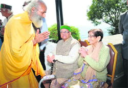 Padma, former MLA from Bhattiyat in Chamba, being greeted by another former MLA in the Assembly in Shimla on Monday. 