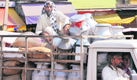A milk supplier with his product in Jammu city.