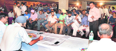 The auction of HIG flats under way in Ludhiana on Monday.