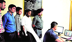 Officers and jawans of the BSF at Khasa Headquarters interact with their wives through video conferencing on the Karva Chauth evening