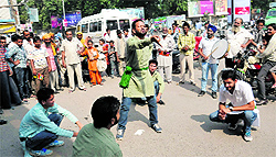 Artistes of Natyam a theatre group, present a street play Samajhdaar Log, at Fire Brigade Chowk in Bathinda on Tuesday