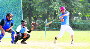 Players in action during a match of the All-India Inter-University Baseball Championship being held at Panjab University in Chandigarh on Tuesday.