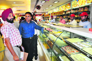 Officials of the Excise Department inspect an eatery at Sector 8 in Chandigarh on Tuesday.