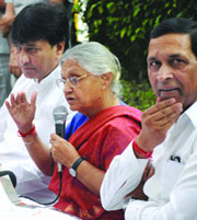 Chief Minister Sheila Dikshit along with two ministers addressing a press conference ahead of the Delhi Assembly elections in New Delhi on Tuesday.