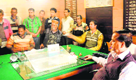 Mazdoor Sangh workers at the office of the executive officer, Municipal Council, in Mussoorie on Tuesday.
