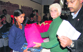 Members of Freemason Lodge distribute stationery to the needy students from Jaunpur development region in Mussoorie.