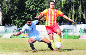 Players in action during the 2nd Narendra Kharola Memorial Football Tournament being played in Dehradun on Tuesday.