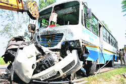The mangled remains of the Xylo vehicle after it collided with a bus in Rohtak on Tuesday. Tribune photo