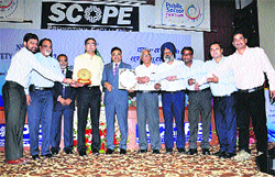 A team of Elin Appliances, Baddi, receives the NSCI-2013 Golden Trophy from officials of the National Safety Council of India in New Delhi