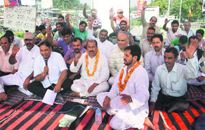 Activists of the BJP Sharnarthi Cell sit on a 24-hour hunger strike to commemorate the Balidan Divas at Satwari Chowk in Jammu on Tuesday. 
