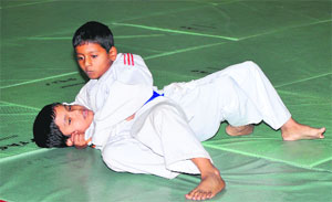 Judokas in action during the judo championship in Jammu. 