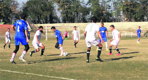 Players in action during a football match in Srinagar on Tuesday.