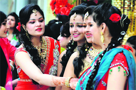 Women take part in Karva Chauth celebrations in Ludhiana on Tuesday.