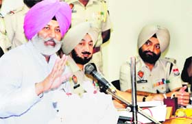 Jatinder Singh Aulakh, Police Commissioner, shows the seized 1 kg heroin during a press conference in Amritsar on Wednesday