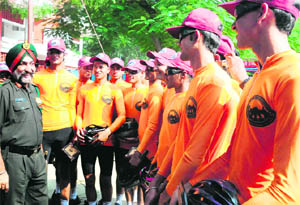 Maj Gen PS Mander interacts with members of an NCC cycling expedition team in Sector 26, Chandigarh, on Wednesday. 