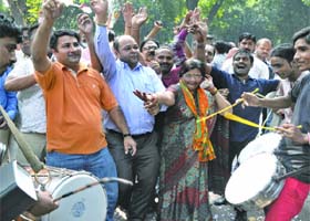 BJP supporters celebrate as Harsh Vardhan was declared the chief ministerial candidate for the Delhi Assembly polls, outside the party head office in New Delhi on Wednesday