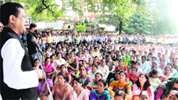 Suryakant Dhasmana, vice-president of Uttarakhand Congress, addresses striking state government employees as a representative of the Chief Minister at Parade Ground in Dehradun on Wednesday.