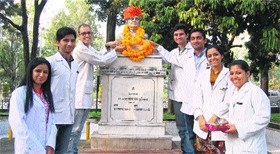 Members of the SCA garland the statue of philanthropist Rai Bahadur Jodhamal Kuthiala at the DRPGMC, Tanda, on Wednesday.