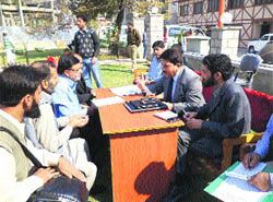 Srinagar Municipal Corporation Commissioner GN Qasba holds a public durbar in Srinagar on Wednesday. 