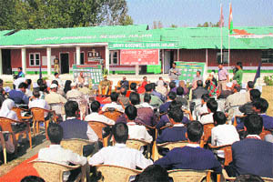 Students along with their parents attend a function at Army Goodwill School in Hajin on Wednesday. 