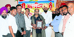 Director General, Secondary Education, Kumar Rahul being felicitated in Mandi Ahmedgarh on Wednesday