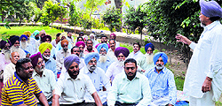 Members of the Tax Virodhi Sangharsh Committee hold a meeting at Chatar Singh Park in Ludhiana on Wednesday