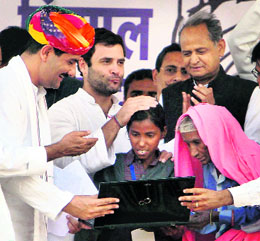 Congress vice-president Rahul Gandhi with Rajasthan CM Ashok Gehlot and Sports Minister Jitendra Singh at a rally in Alwar district on Wednesday.