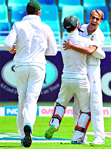 South Africas Imran Tahir (right) celebrates after dismissing Pakistan's captain Misbah Ul-Haq during the first day of the second Test in Dubai on Wednesday
