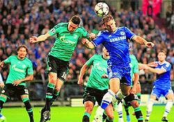 Chelsea's Branislav Ivanovic, center right, heads the ball to serve teammate Fernando Torres to score the opening goal during the Champions League match between FC Schalke and Chelsea on Tuesday