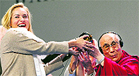 US actor Sharon Stone receives the Nobel Peace Laureates Summit Peace Prize from the Dalai Lama in Warsaw, Poland, on Wednesday