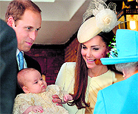 Prince William and his wife Catherine with their son Prince George at Chapel Royal in London on Wednesday