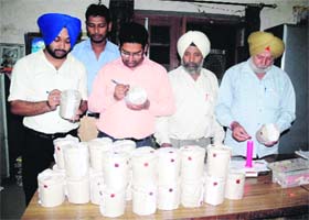 A Health Department team collects samples of sweets during a raid
