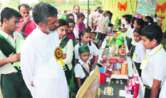 Students demonstrate models to Father Peter D'mello during the innovative exhibition at St. Xavier's Senior Secondary School on Thursday. Tribune photo: Pawan Sharma