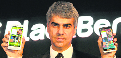 BlackBerry Managing Director for India, Sunil Lalvani, poses with BlackBerry 'Z30' smartphone at its launch in New Delhi on Thursday. It is priced at Rs 39,990.