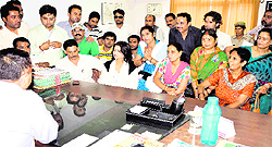 Garhwal Commissioner DS Gabriyal tries to pacify BJP activists before the board meeting of the Haridwar Development Authority in Haridwar on Wednesday. However, the meeting was cancelled