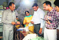 Forensic experts inspect the spot where a jeweller was murdered in Assandh on Thursday. 