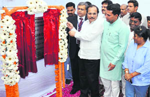Minister of State for Railways Adhir Rajan Chowdhary inveils a plaque for a solar power plant at the Gurgaon railway station on Thursday. 