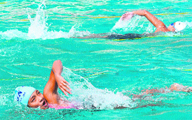 A swimming contest in progress during the stat-level games for women at Karan Stadium in Karnal.