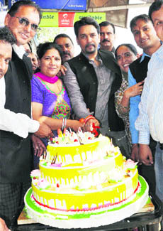 Anurag Thakur, president, HPCA, and MP, Hamirpur, cuts a cake on his birthday at Dharamsala on Thursday. 