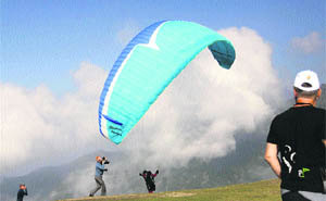 A paraglider in action on the first day of the Pre-World Cup Paragliding Championship at Billing in Kangra on Friday. 