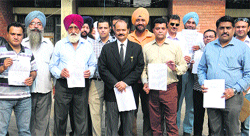 Property investors in the Curo High Street project, after giving their memorandum to the city police, in Jalandhar on Thursday. Tribune photo
