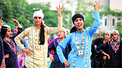 Girls present a dance programme during the concluding function of the BSF Inter Frontier Hockey Tournament in Jammu on Thursday