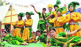 Students give a dance performance during a Diwali function at SDP College in Ludhiana.