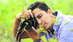 A student takes a picture during the photography competition at Punjab Agricultural University on Thursday.
