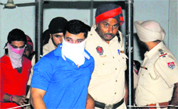 Two of the seven convicts come out of the court in Jalandhar on Thursday. Tribune photo: Malkiat Singh