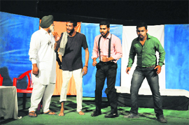 Artistes enact a scene from the play Kuj Taan Karo Yaaro at the Balwant Gargi Open Air Theatre on Friday.