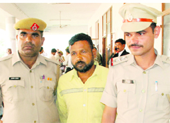 The accused, Salim, being produced in a court in Panchkula on Friday. Tribune Photo: Nitin Mittal
